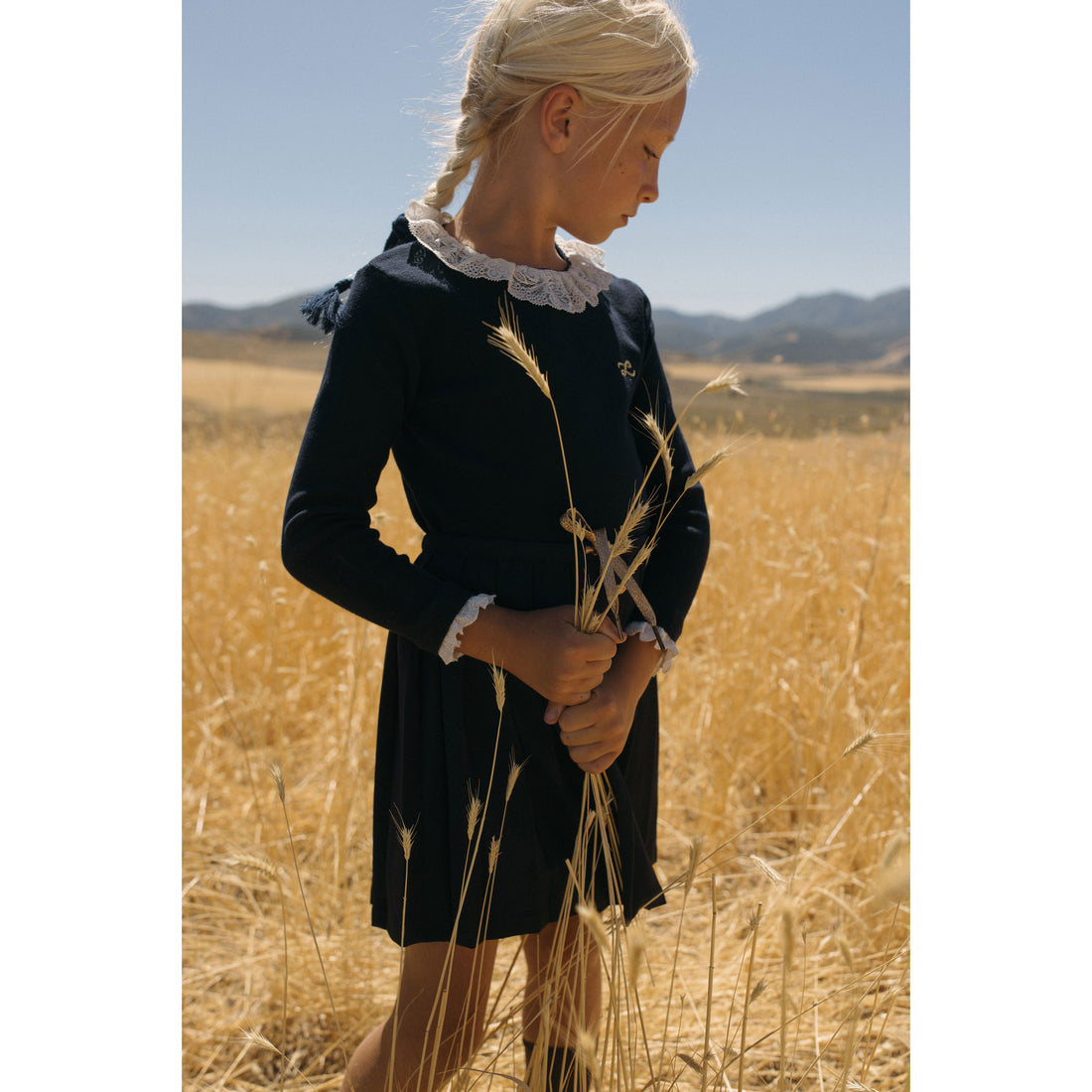 LBL75 Ladida Navy knit sweater with eyelet trim on neckline