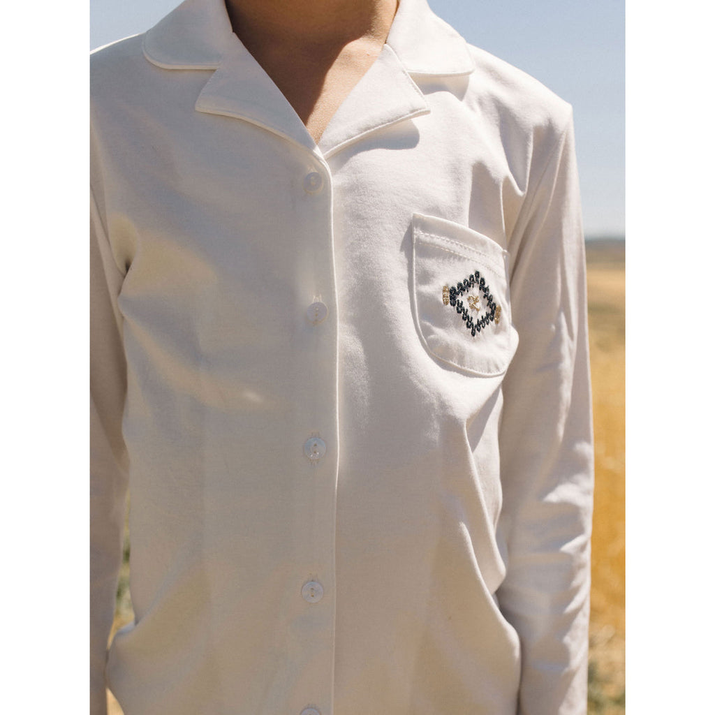 Camisa blanca para niño LBL50 Ladida con gráfico L en el bolsillo